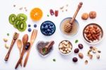 Ingredients For A Healthy Foods Background, Nuts, Honey, Berries Stock Photo