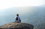 Young Man  Asia Tourist  At Mountain Is Watching Over The Misty Stock Photo