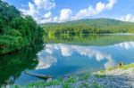 Landscape Of The Dam And Lake On The Mountain With Tree And Forest And The Boat Stock Photo