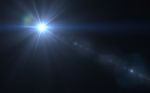 Abstract Lens Flare Light Over Black Background Stock Photo