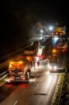 Road Works, Removal Of Old Asphalt Pavement At Night Stock Photo