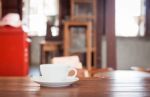 White Coffee Cup On Wooden Table Stock Photo