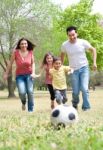 Family Playing Football Stock Photo