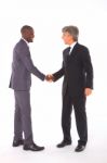 Businessmen Shaking Hands Stock Photo