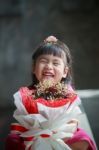 Asian Girl With Dry Flower Bouquet In Hand Laughing With Happiness Emotion Stock Photo