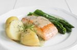 Grilled Salmon With Boiled Potatoes And Asparagus On White Plate Stock Photo