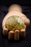 Global In Wooden Hand Stock Photo