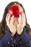 Teen Holding A Pomegranate Stock Photo