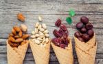 Concept For Homemade Various Nuts Ice Cream. Mixed Nuts In Waffl Stock Photo