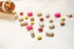 Top View Of The Pills On The White Background, The Drug And Capsule Pills On The Floor Stock Photo