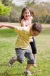 Brother Pulling His Sister Stock Photo