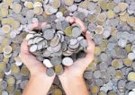 A Lot Of Coins In Hands Stock Photo