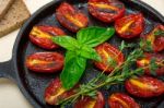 Baked Cherry Tomatoes With Basil And Thyme Stock Photo