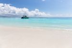 Boat On Clear Sea And Sand With Blue Sky Background In Phuket, Thailand Stock Photo