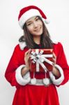 Santa Claus Hat With Red Christmas Gift Box Stock Photo