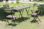 Outdoor Tables And Chairs Set Up On The Green Lawn Stock Photo