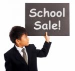 Schoolboy With School Sale Board Stock Photo