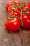 Fresh Cherry Tomatoes On A Cluster Stock Photo