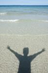 Shadow Man On Beach Stock Photo