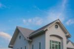 Twin Gable Roof House Under Sky Stock Photo