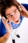 Top View Of Shouting Male Enjoying Music Stock Photo