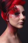 Young Girl With Red Hair And Creative Ingenious Makeup Stock Photo