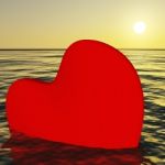 Heart Sinking Into Sea Stock Photo