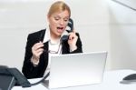 Woman Trying To Convince Client Over The Phone Stock Photo