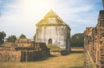 Old Ancient Pagoda In Lopburi Thailand, With Old Exterior Brick Wall Background Vintage Style Grung Texture Stock Photo