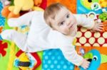 Infant Boy On Playmat Stock Photo