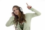 Lady Pointing Out With Headphone Stock Photo