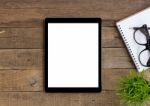 Digital Tablet On Wood Table Blank Space For Adjustment Stock Photo