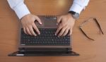 Businessman Is Typing On Laptop Stock Photo