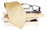 Glasses, Pile Of Books And Tie  Stock Photo