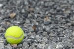 Tennis Balls Lay On The Gravel Stock Photo