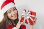 Santa Claus Hat With Red Christmas Gift Box Stock Photo