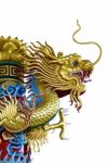 Golden Dragon Statue On White Background Stock Photo