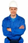 Smiling Builder With Arm Crossed Stock Photo