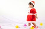 Little Girl With Santa Costume Stock Photo