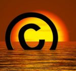 Copyright Symbol Sinking In Sea Stock Photo