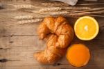 Tasty Croissant And Orange Juice Still Life Rustic Stock Photo