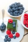 Green Tea Matcha Mousse Cake With Berries Stock Photo