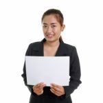 Happy Businesswoman Holding A White Banner Stock Photo