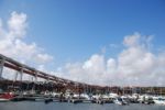 Lisbon's Docks Under April 25th Bridge Stock Photo