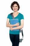 College Student With Stylish Sling Bag And Notebook Stock Photo