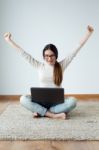 Beautiful Young Woman Working On Her Laptop At Home Stock Photo