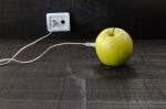 Green Apple Connected To An Ethernet Cable Stock Photo