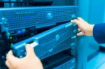 Man Fix Server Network In Data Center Room Stock Photo