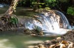 The Water Flowing Over Rocks And Trees Down A Waterfall At Huay Mae Khamin Waterfall National Park ,kanchana Buri In Thailand Stock Photo