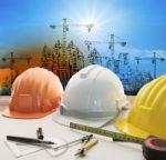 Safety Helmet On Architect ,engineer Working Table With Modern B Stock Photo